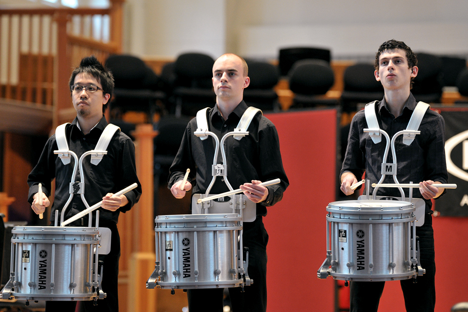 Three members of H漫画 group Redhocks performing at the H漫画 Festival of Percussion